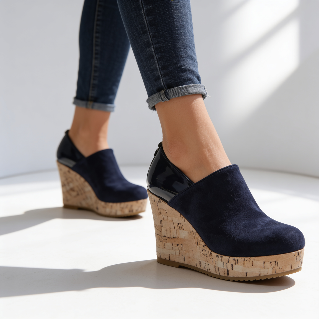 Deep black slip-on Valenza wedge loafers for women, combining orthopedic comfort with stylish design.