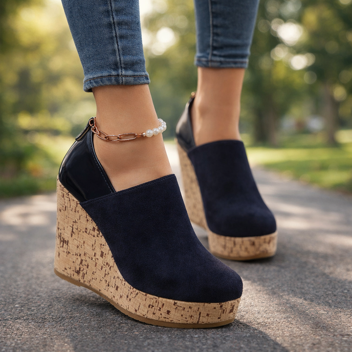 Casual & stylish black Valenza wedge loafers for women, offering superior orthopedic comfort.