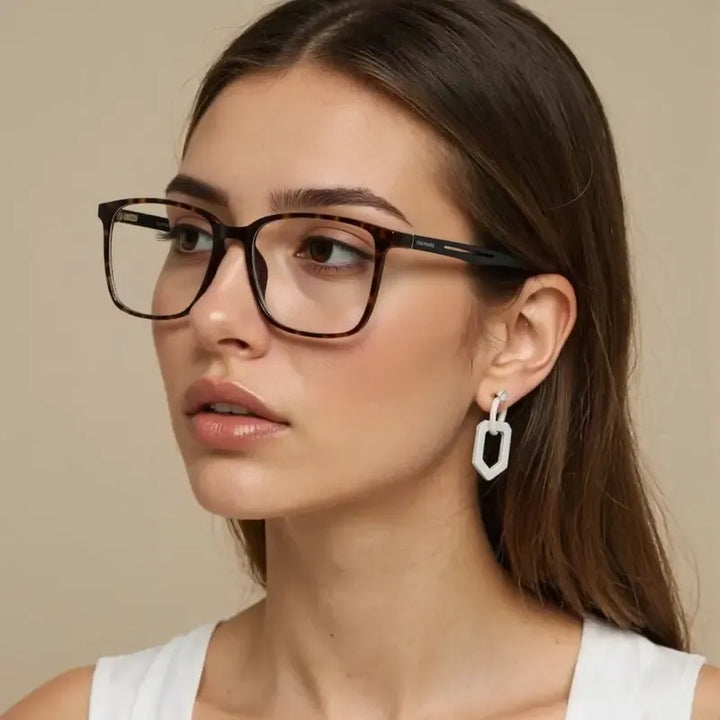 Clear vision Valmira women's square optical glasses with durable polycarbonate lenses & sleek design.