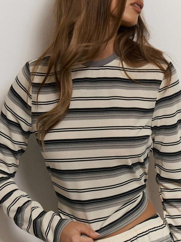 Detail of the relaxed knit texture of a women's striped two-piece lounge set, ultimate comfort.