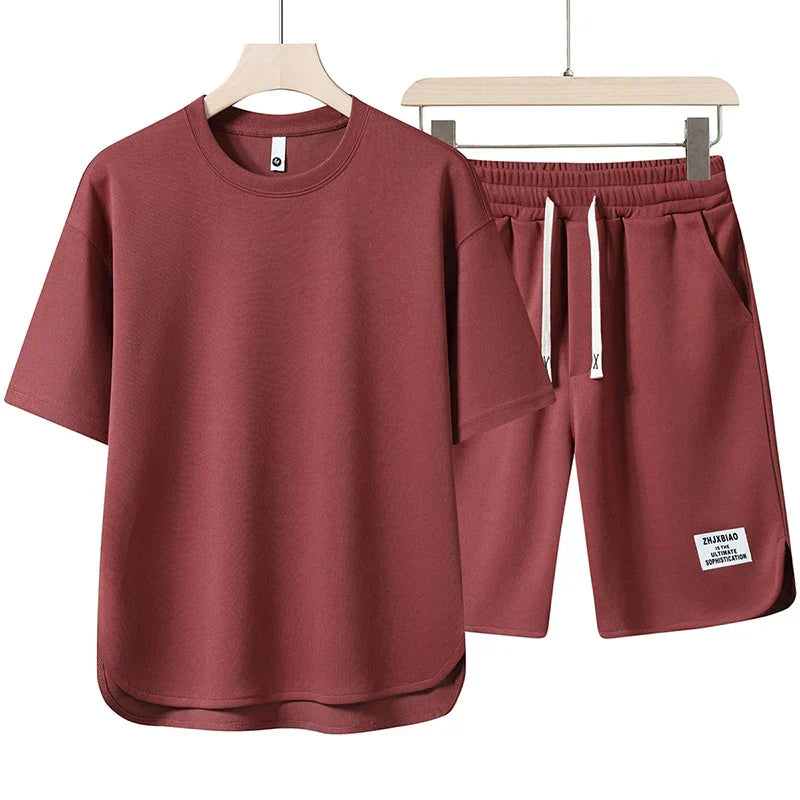 Trendy women's two-piece varsity lounge set with an oversized top & comfy shorts. Summer casual apparel.