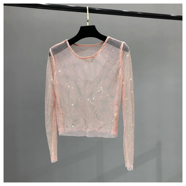 Elegant women's shiny long sleeve blouse with glamorous rhinestone detailing, ideal for evening events.