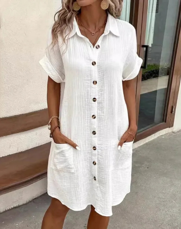 Women's versatile button-down shirt mini dress in white for effortless casual style.