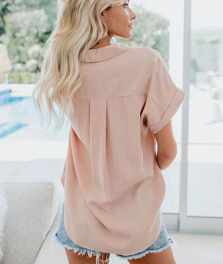 Flowy women's summer blouse, a chic versatile top for effortless day-to-night styling.
