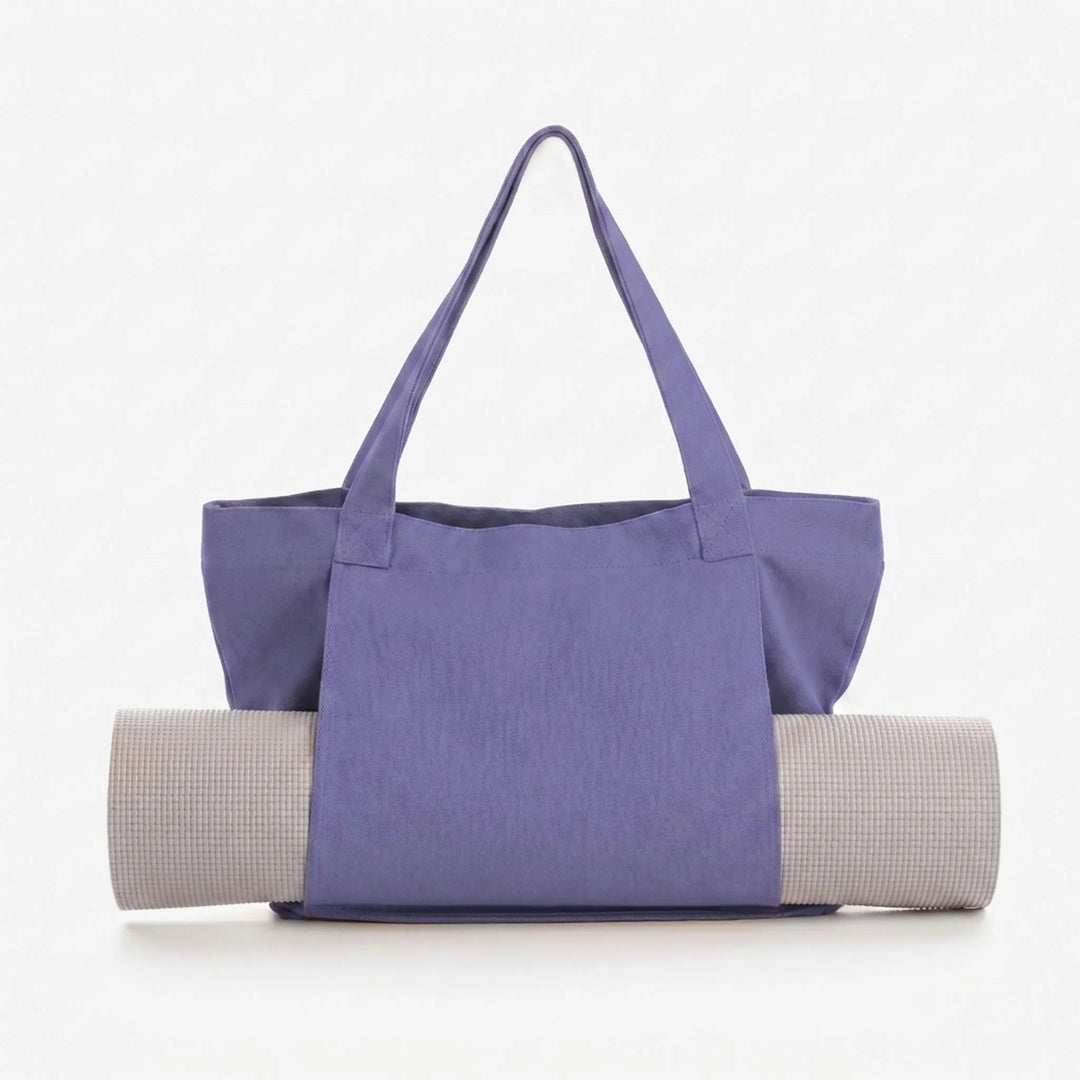 Spacious women's yoga mat tote bag for fitness, gym, and everyday essentials. Convenient shoulder carry.