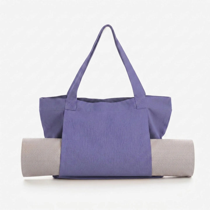 Spacious women's yoga mat tote bag for fitness, gym, and everyday essentials. Convenient shoulder carry.