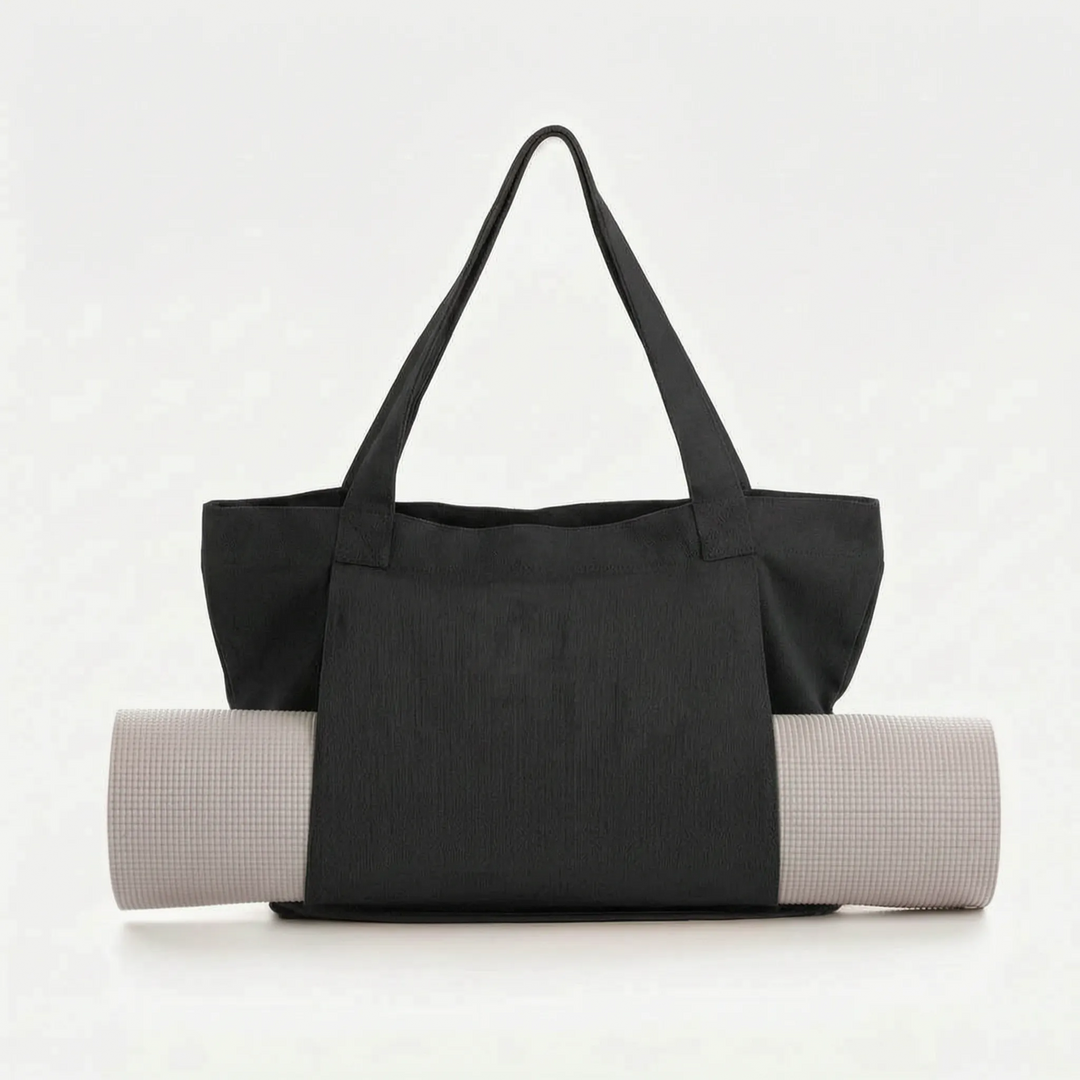 Versatile women's yoga mat tote bag. A stylish canvas shoulder bag for gym, fitness, and everyday carry.