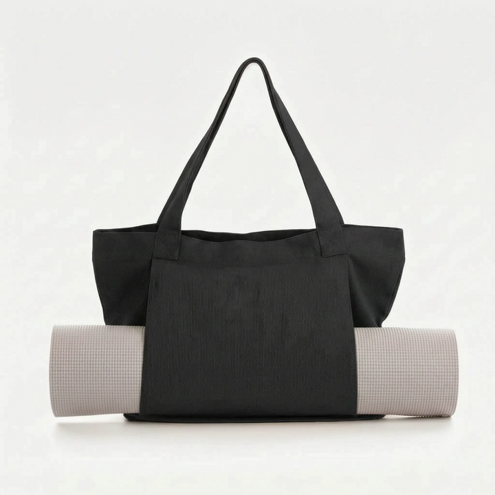 Versatile women's yoga mat tote bag. A stylish canvas shoulder bag for gym, fitness, and everyday carry.