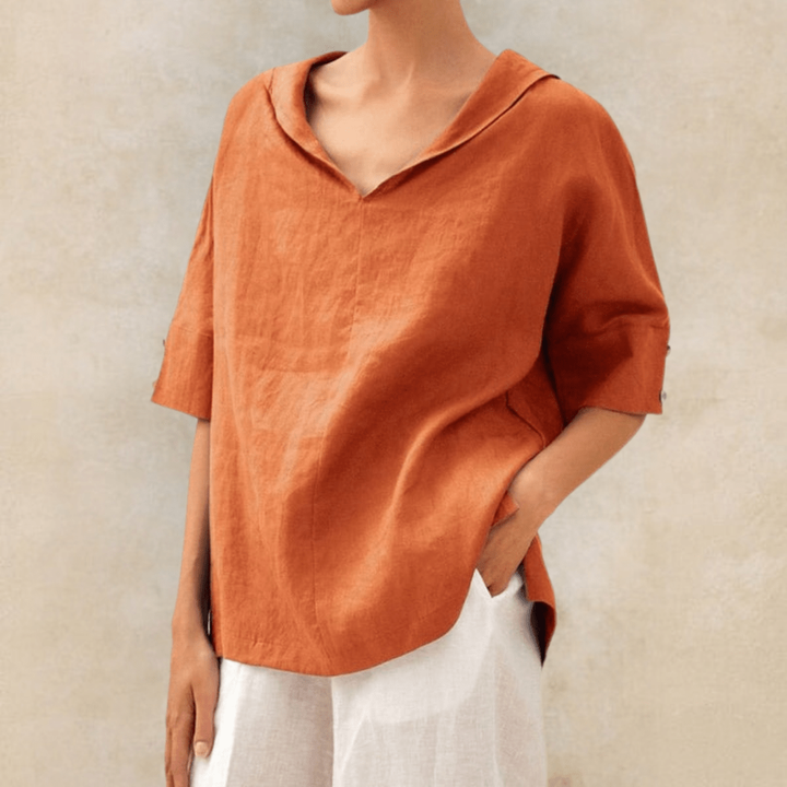 Stylish long sleeve women's collared V-neck tunic, offering comfortable and effortless fashion.