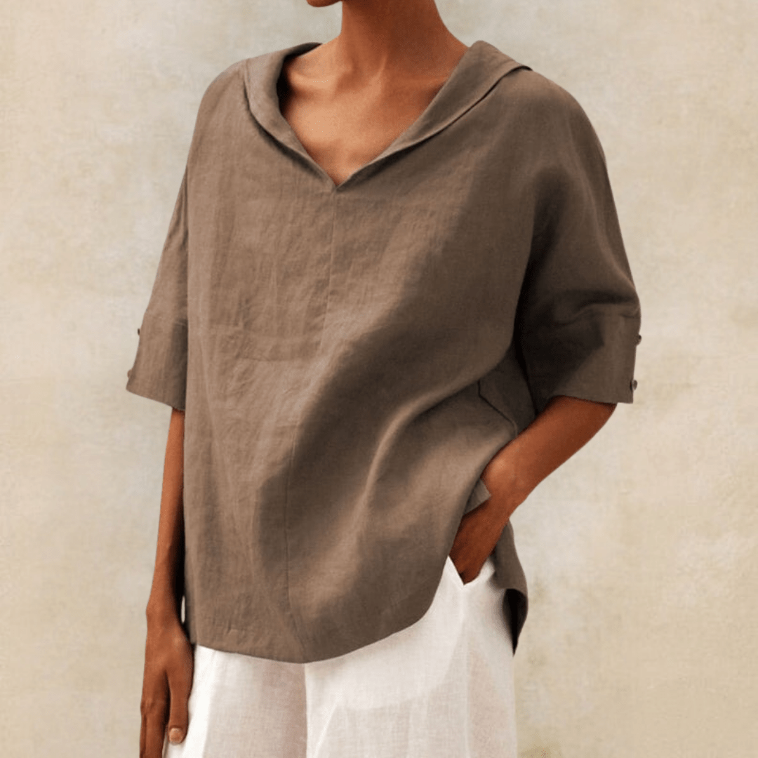 Relaxed fit women's tunic top with a chic collared V-neck design, ideal for versatile wear.