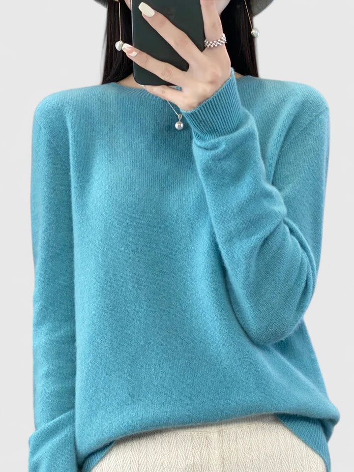Timeless women's knit sweater, offering a relaxed fit and long sleeve warmth.