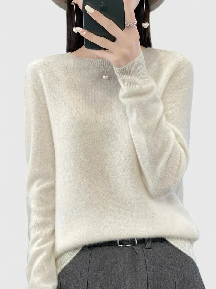 Women's soft knit long sleeve sweater, perfect for timeless everyday fashion.
