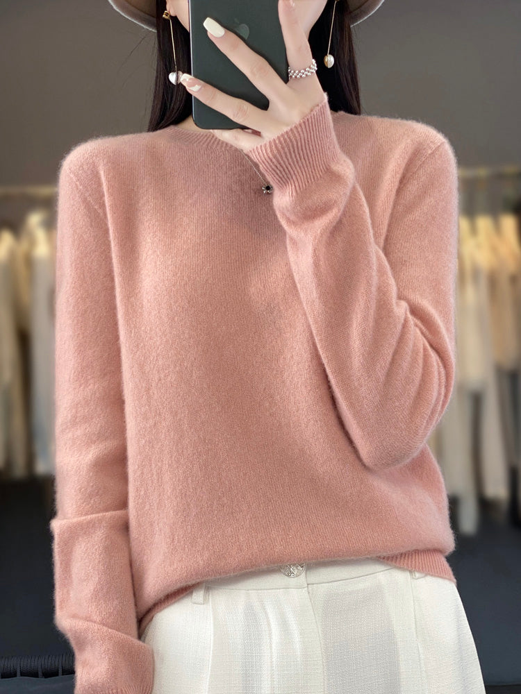 Women's round neck sweater with soft knit texture, great for versatile layering.