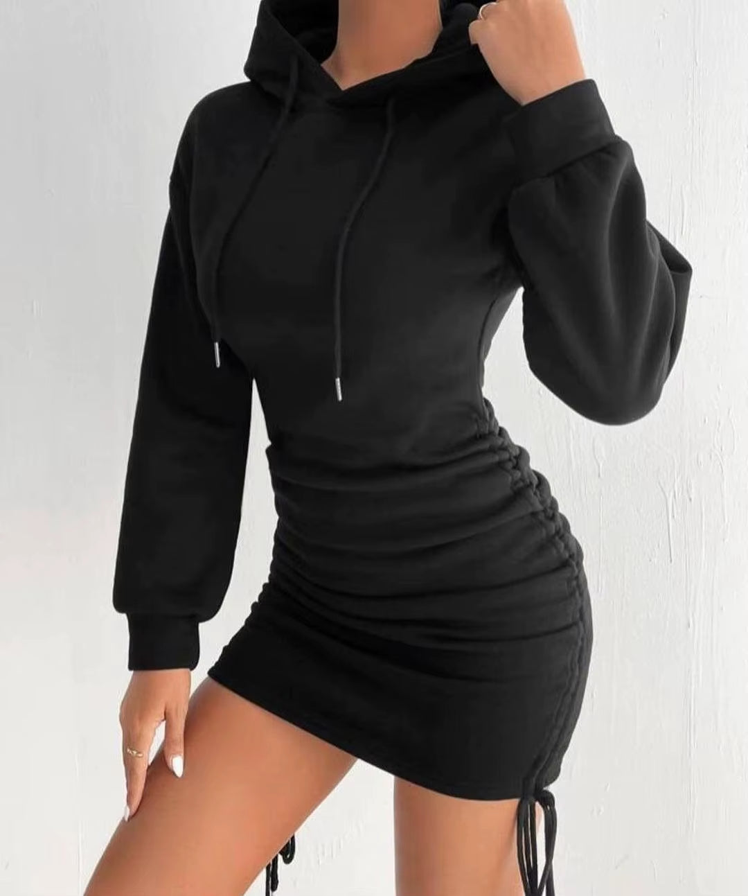 Everyday women's fashion: a comfortable, versatile hoodie dress with stylish adjustable ruched sides.