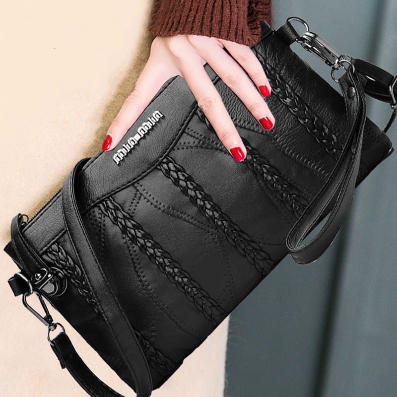 Stylish women's PU leather crossbody bag with adjustable strap, offering hands-free convenience and sleek design.