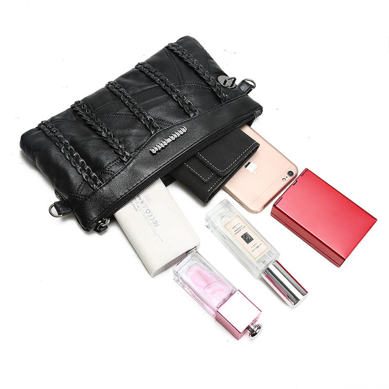 Close-up of the spacious interior of a women's versatile PU leather crossbody clutch, revealing organized pockets.