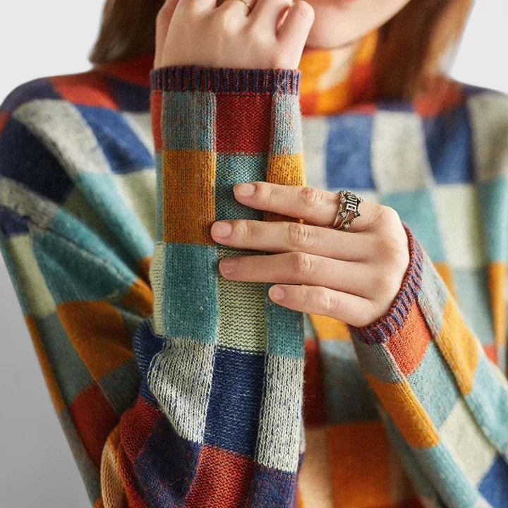 Cozy women's long sleeve check pattern sweater, chic and relaxed fit for winter wear.