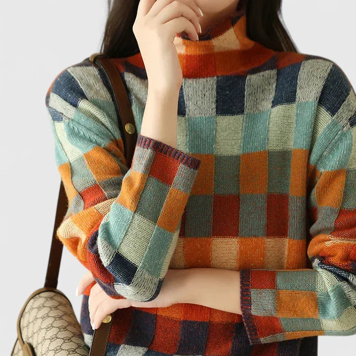 Stylish women's vibrant check pattern sweater, cozy wear with long sleeves, perfect for casual chic.