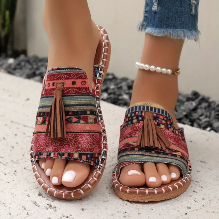 Women's vibrant flat sandals, perfect for everyday comfort & style.