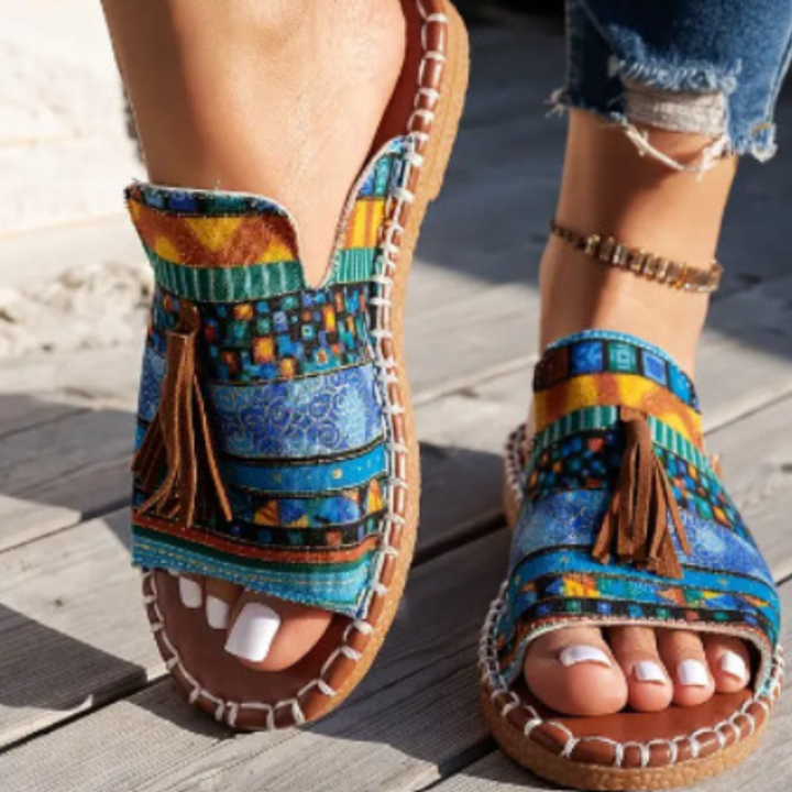 Slip-on vibrant women's flat sandals, ideal for casual summer outfits & comfort.