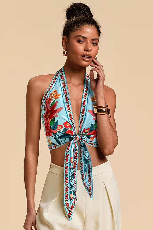 Sleeveless vibrant floral halter top for women, a stylish addition to any summer collection.