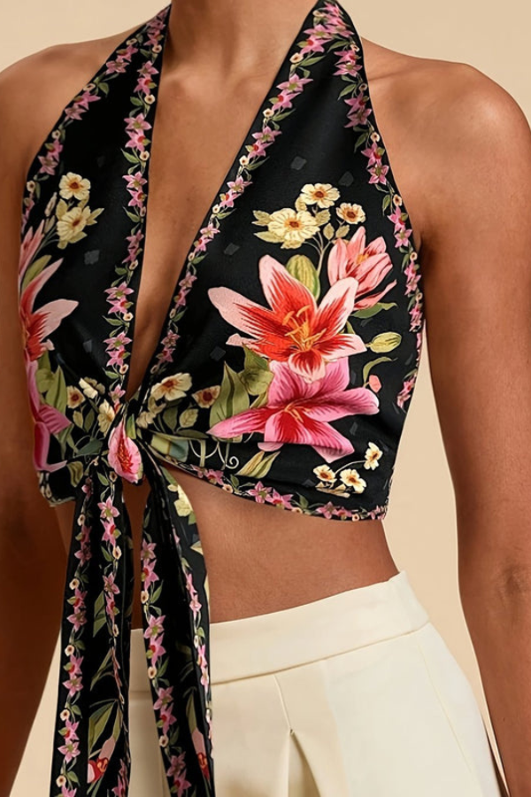 Women's sleeveless top: a vibrant floral halter design for a stylish summer look.