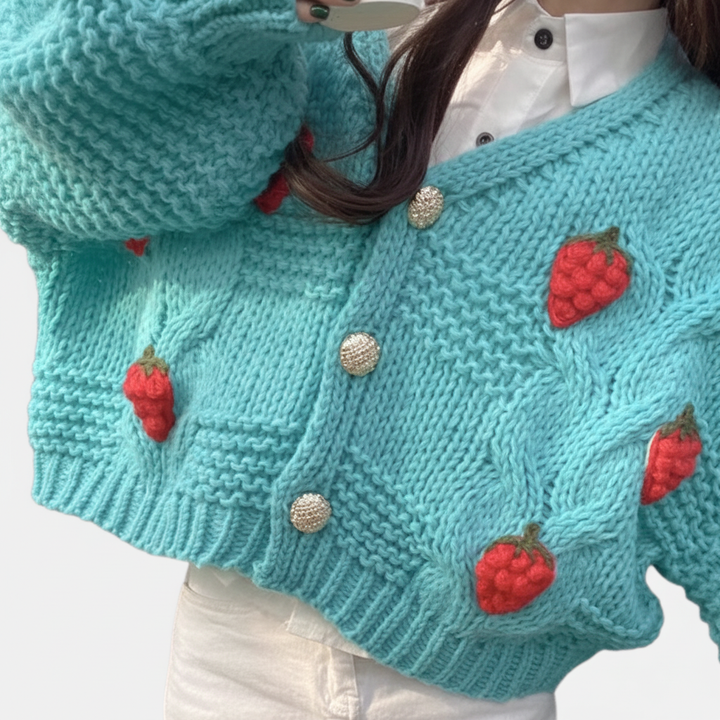 Stylish women's short cardigan, brightly colored with strawberry motifs, ideal for spring