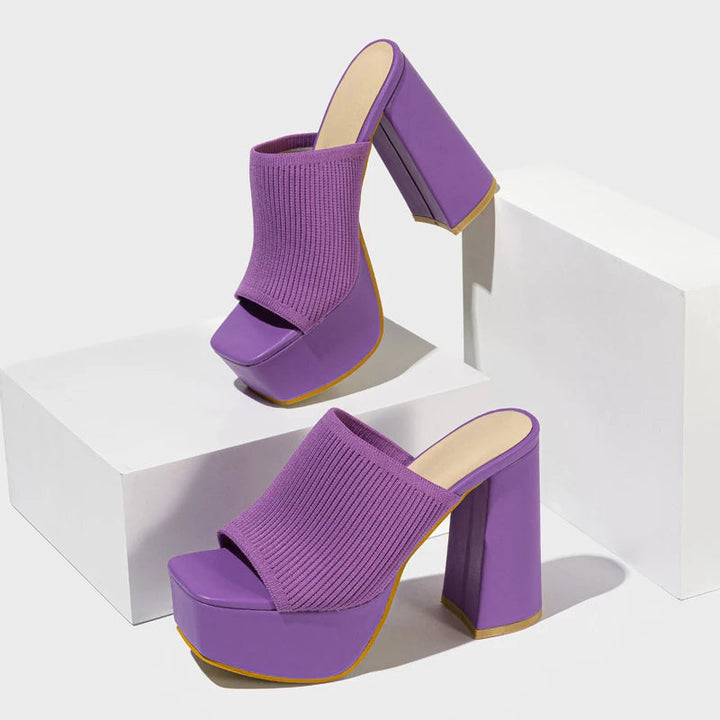 Purple neon platform block heel mules. Women's vibrant Y2K retro slip-on shoes for parties.