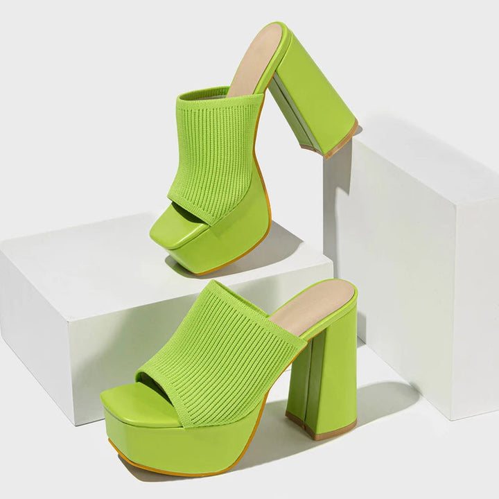 Y2K statement neon platform block heels. Vibrant women's party footwear with a chunky retro style.