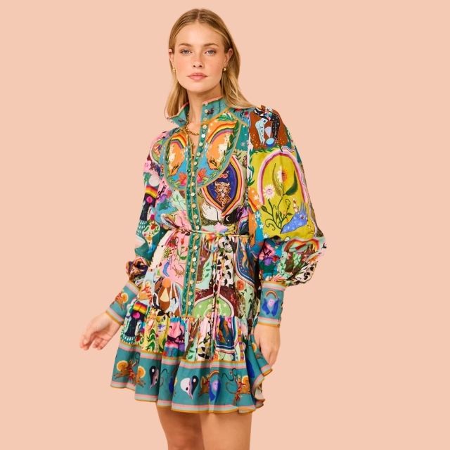 Close-up of women's mini dress with a lively, abstract vibrant print. Ideal colorful summer party dress fashion.