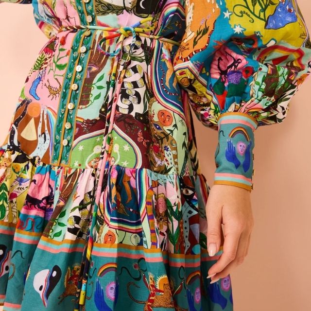 Cheerful women's vibrant print mini dress. A colorful, sleeveless design ideal for summer fashion and casual wear.