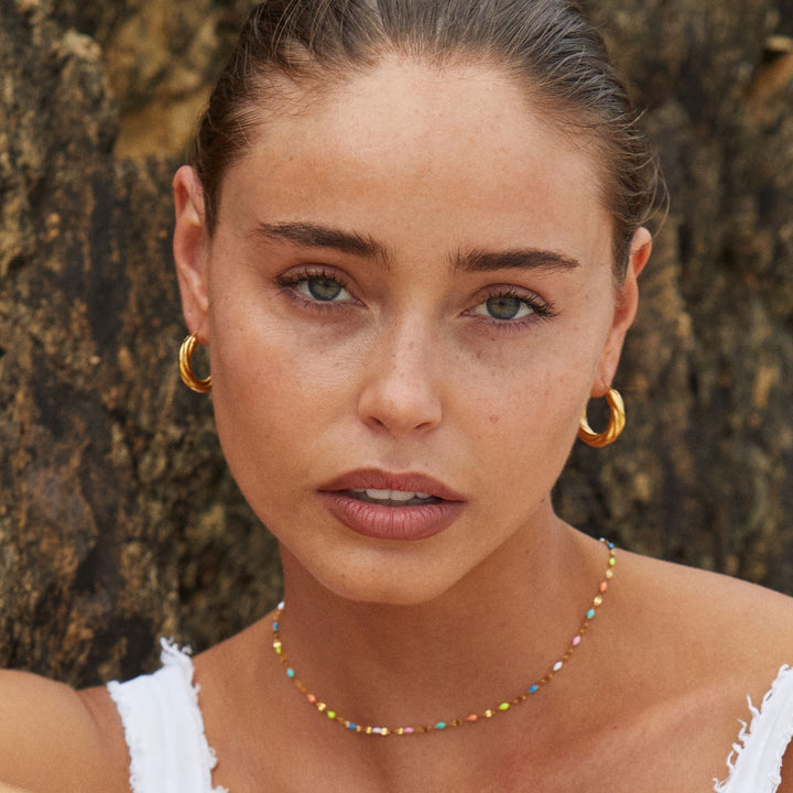 Gold plated rainbow choker, hypoallergenic & waterproof, a durable and stylish women's jewelry piece.