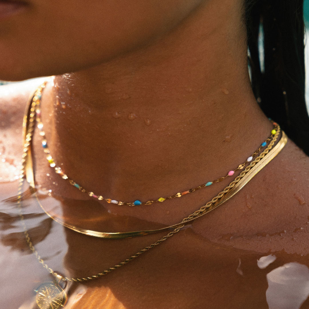 Colorful enamel rainbow choker necklace for women, a vibrant fashion accessory to brighten any outfit.