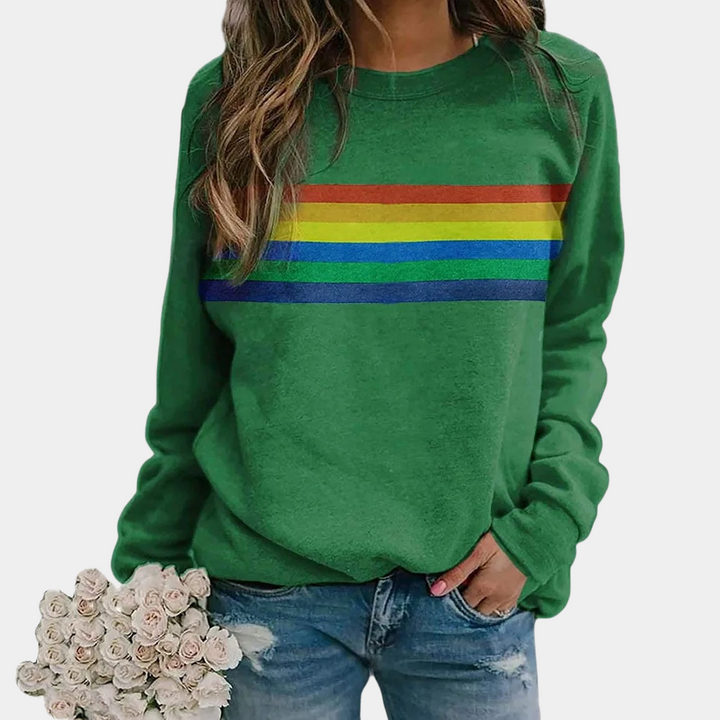 Relaxed fit women's rainbow stripe crewneck sweatshirt, a vibrant and cozy sweater for casual layering.