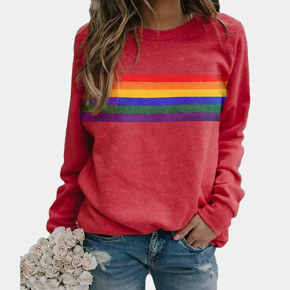 Vibrant rainbow stripe women's crewneck sweatshirt. A colorful and comfortable sweater for relaxed everyday wear.