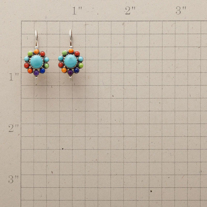 Close-up of stylish women's turquoise & multicolor hoop earrings, perfect fashion jewelry or a gift for her.