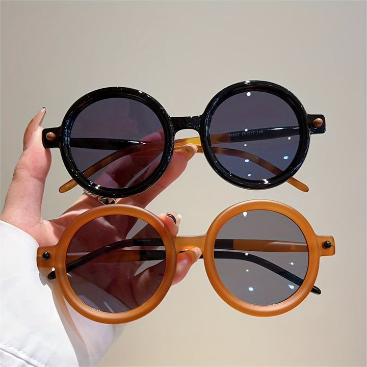 Classic women's circular acetate sunglasses, offering trendy vintage style and UV400.