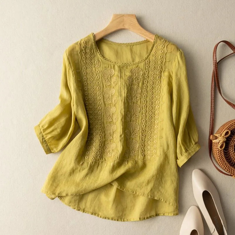 Feminine women's vintage embroidered shirt. Sheer puff sleeves add a touch of casual chic for spring.