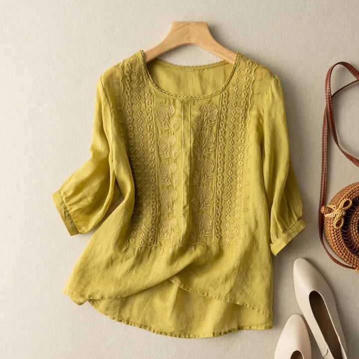 Feminine women's vintage embroidered shirt. Sheer puff sleeves add a touch of casual chic for spring.