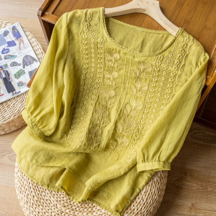 Detailed vintage embroidered blouse for women, featuring trendy sheer puff sleeves. Perfect for elegant looks.