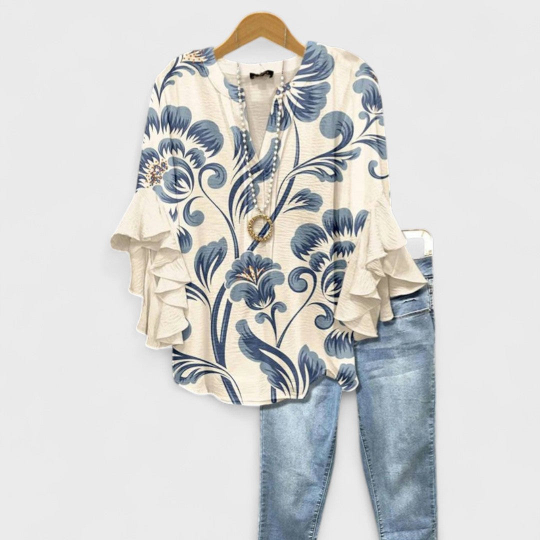 Women's vintage floral V-neck blouse with delicate ruffle sleeves, perfect for spring casual chic.