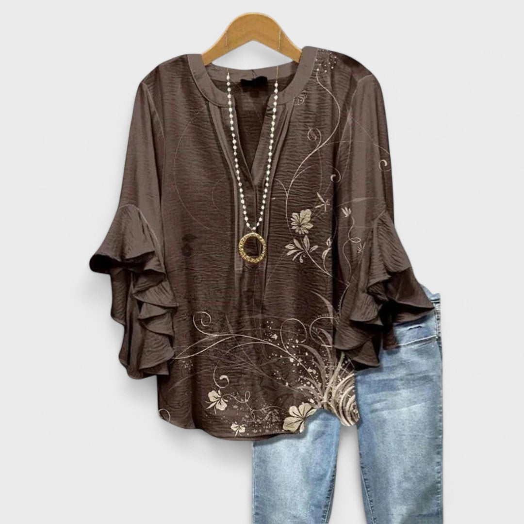 Chic women's floral ruffle-sleeve V-neck top, a versatile piece for spring fashion and summer casual.