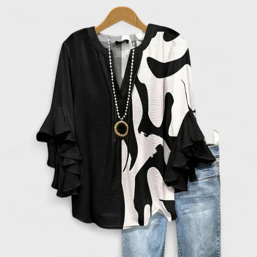 Stylish women's vintage floral blouse, featuring elegant ruffle sleeves and a classic V-neck design.