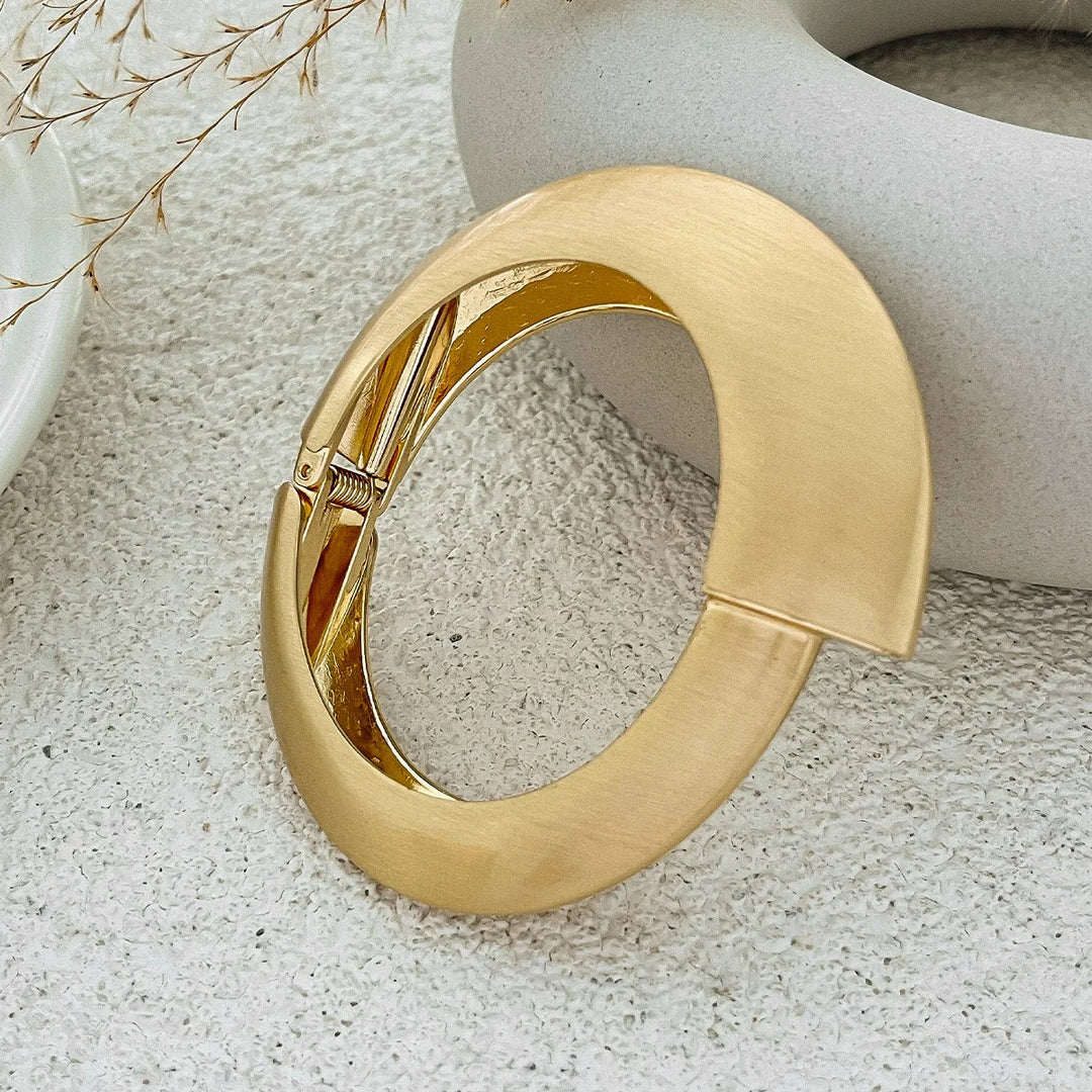 Classic women's vintage gold cuff bracelet set, featuring brushed metal texture and organic, timeless appeal.