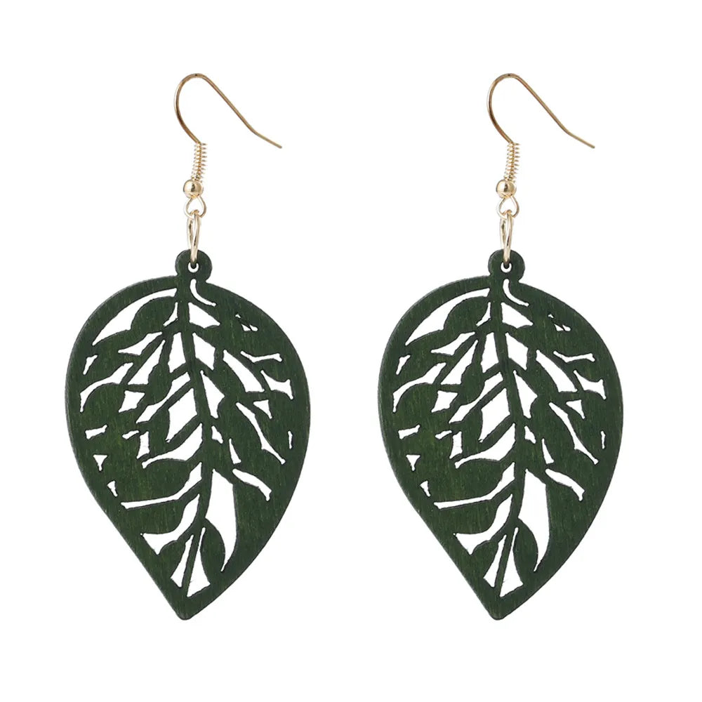 Women's vintage green carved wooden dangle earrings; unique handmade eco-friendly fashion accessory.