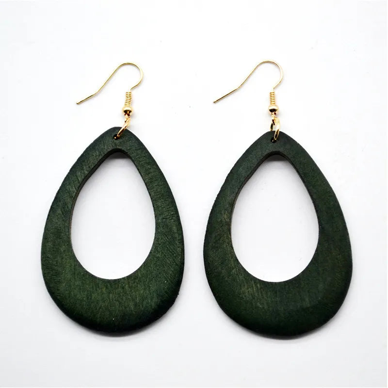 Elegant vintage green carved wooden earrings; unique handmade eco-friendly dangle jewelry for women.