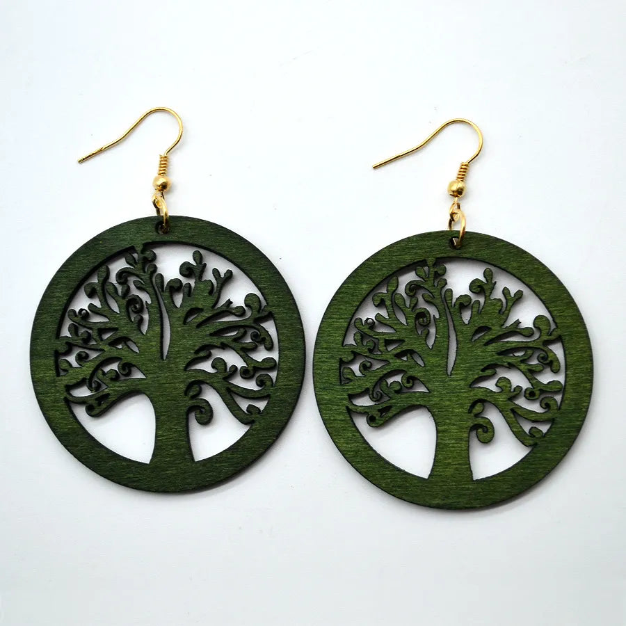 Artisan carved green wood earrings; vintage style handmade dangle jewelry, unique and eco-conscious fashion.