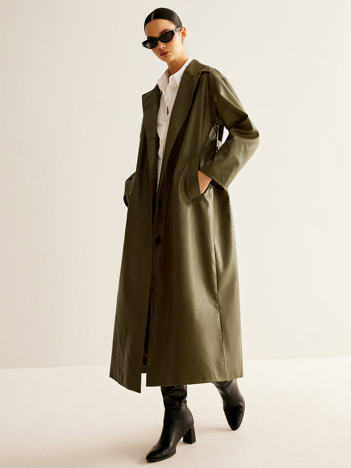 Timeless women's vintage green longline leather coat. Versatile for casual wear, party, or work attire.