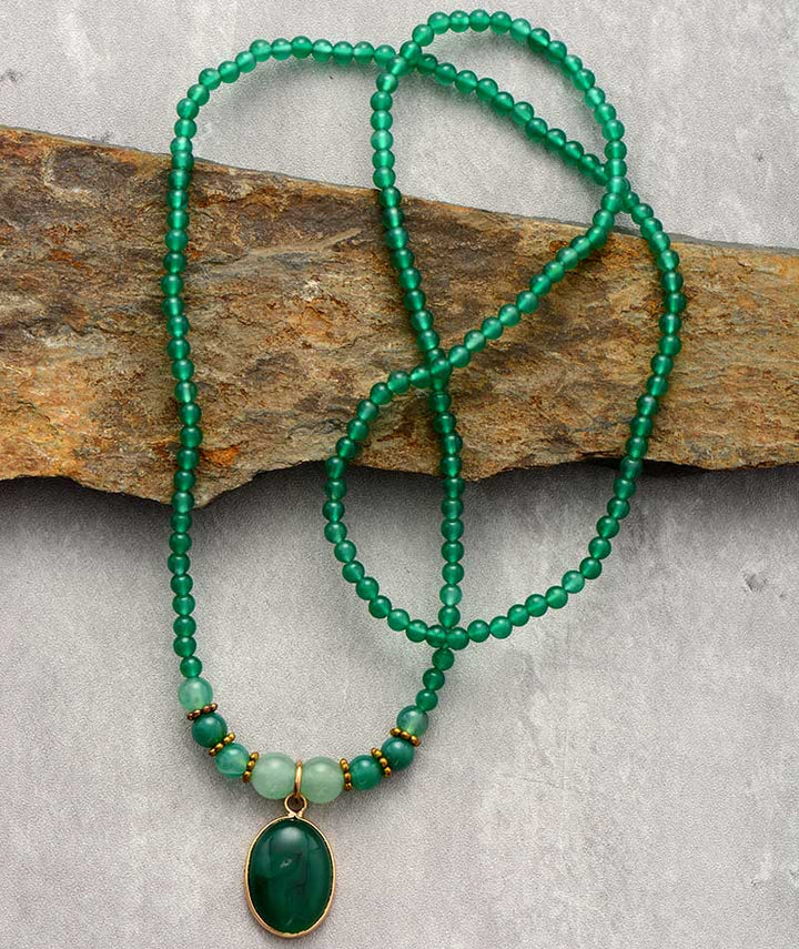 Elegant vintage green onyx necklace, a unique healing jewelry piece with a calming gemstone for women.
