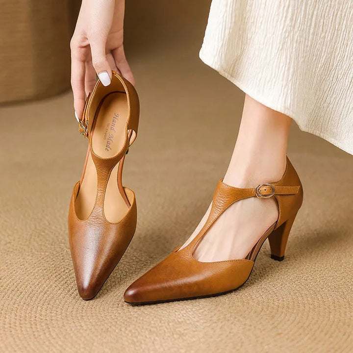 Women's vintage-inspired T-strap heels in classic black, perfect for elegant or formal occasions.